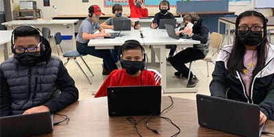 Lacomb School students with headphones and calculators - Education grant from Oregon State Credit Union